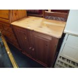 A MODERN HONEY PINE TWO DOOR CABINET H 81 W 80 CM