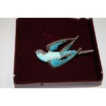 AN ENAMELLED BIRD BROOCH