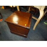 AN ANTIQUE COMMODE