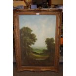 A GILT FRAMED OIL ON CANVAS SIGN R WITCHART OF A WOODED LANDSCAPE