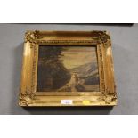 A GILT FRAMED VICTORIAN OIL ON CANVAS DEPICTING A HIGHLAND RIVER SCENE WITH FIGURES AND DOGS