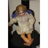 A LARGE VINTAGE GERMAN HANDWERCK HALBIG PORCELAIN HEADED DOLL 'FREDA' WITH DAMAGES