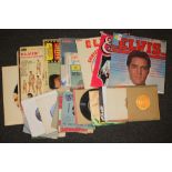 A COLLECTION OF ELVIS PRESLEY LP RECORDS AND 7" SINGLES ETC