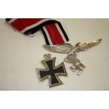 A NAZI STYLE IRON CROSS PENDANT TOGETHER WITH ANOTHER