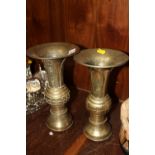A NEAR PAIR OF ORIENTAL STYLE BRASS VASES