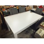 A MODERN WHITE DRAWLEAF EXTENDING DINING TABLE WITH SIX MODERN GREY DINING CHAIRS