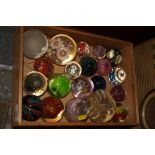 A COLLECTION OF GLASS AND LUCITE PAPERWEIGHTS