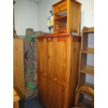 A MODERN TRIPLE PINE WARDROBE W 107 CM AND A PINE BEDSIDE CABINET (2)