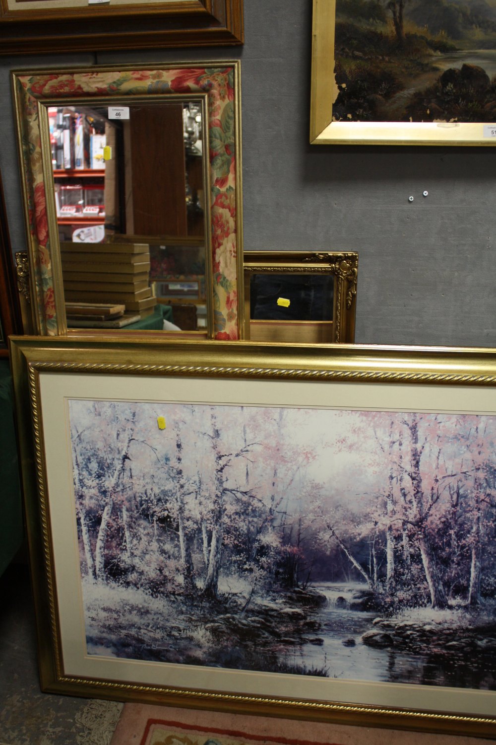 A GILT FRAMED BEVEL EDGED MIRROR TOGETHER WITH ANOTHER, LARGE GILT FRAMED PRINT ETC