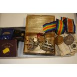 A TIN OF MEDALS AWARDED TO 36772 PTE R B NAYLOR WEST YORKSHIRE REGIMENT TOGETHER WITH CAP BADGES AND