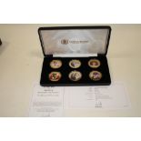 A CASED HEIRLOOM ENAMELLED 6 COIN COLLECTION