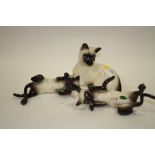 A ROYAL DOULTON SIAMESE CAT FIGURE 1558, TOGETHER WITH A BESWICK EXAMPLE AND AN UNMARKED EXAMPLE (3)