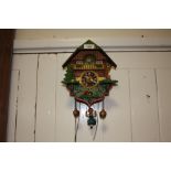 A PAINTED WOODEN CUCKOO CLOCK