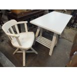 A MODERN WHITE TRESTLE TABLE DESK AND SWIVEL CHAIR (2)