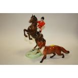 A BESWICK HUNTSMAN FIGURE S/D TOGETHER WITH A LARGE BESWICK FOX (2)