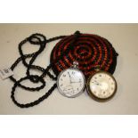 A BEADWORK PURSE CONTAINING TWO POCKET WATCHES