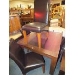 A MODERN DARK SQUARE DINING TABLE WITH FOUR LEATHER STYLE DINING CHAIRS TABLE W 110 CM