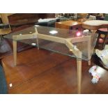 A MODERN GLASS TOP COFFEE TABLE