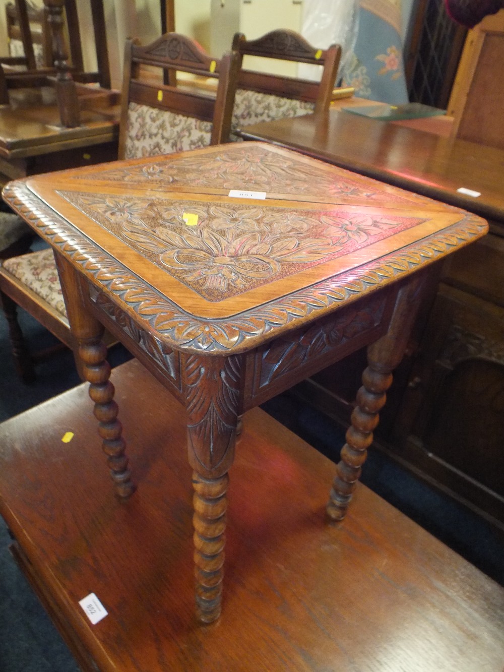 A SMALL CARVED OAK AND BARLEYTWIST OCCASIONAL TABLE