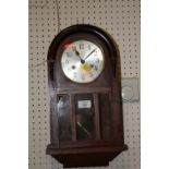 A DOME TOPPED MAHOGANY WALL CLOCK