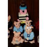 FOUR WADE NAT WEST PIGS TOGETHER WITH A PLASTIC BERTIE BASSETT MONEY BANK