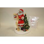 A BOXED ROYAL DOULTON SANTAS CHRISTMAS LIST FIGURE