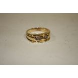 A LARGE 10K GOLD GENTS FIVE STONE DIAMOND RING