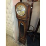 AN OAK CASED GRAND MOTHER CLOCK