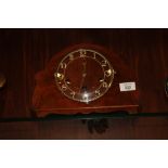 A VINTAGE WALNUT DUAL CHIME MANTLE CLOCK