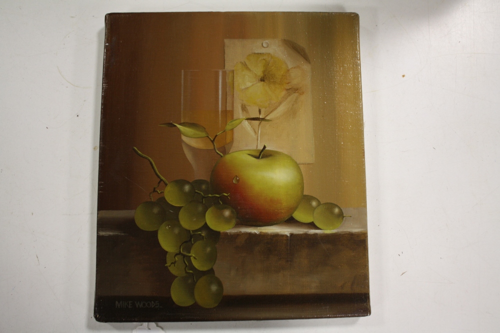 MIKE WOODS (1967). 'Still Life Study of Apple, Grapes and Wine', signed lower left, oil on canvas,