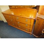 A HONEY PINE 'YOUNGER' SIX DRAWER CHEST W 122 CM
