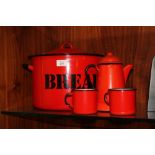 AN ENAMEL BREAD BIN TOGETHER WITH AN ENAMEL COFFEE POT AND TO MUGS