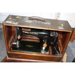 A CASED VINTAGE SINGER SEWING MACHINE