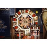 THREE BOXED PIECES OF OLD IMARI PATTERN ROYAL CROWN DERBY PORCELAIN COMPRISING OF AN OCTAGONAL