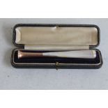 A MOTHER OF PEARL 9CT GOLD MOUNTED CIGARETTE HOLDER, in fitted case