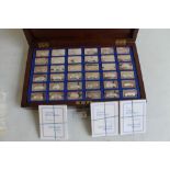 A CASED SET OF 36 SILVER INGOTS, "The Lord Montagu Collection of Great Cars" with certificates of