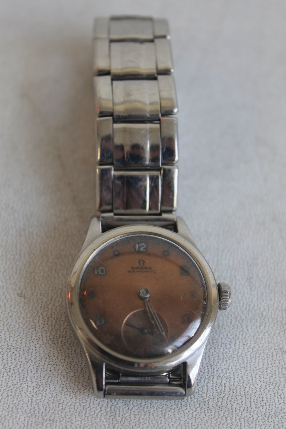 A 1940S OMEGA NON MAGNETIC WRISTWATCH WITH UNUSUAL REAL COPPER DIAL (AS USED BY PEOPLE WORKING IN