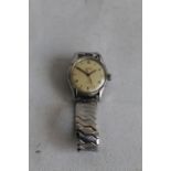 A VINTAGE EBERHARD & CO. PARE CHOC MILITARY STYLE GENTS STEEL WRIST WATCH on later expander strap,