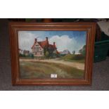 A FRAMED AND GLAZED OIL ON BOARD OF A RURAL VILLAGE SCENE WITH TUDOR BUILDING SIGNED J.WOOD