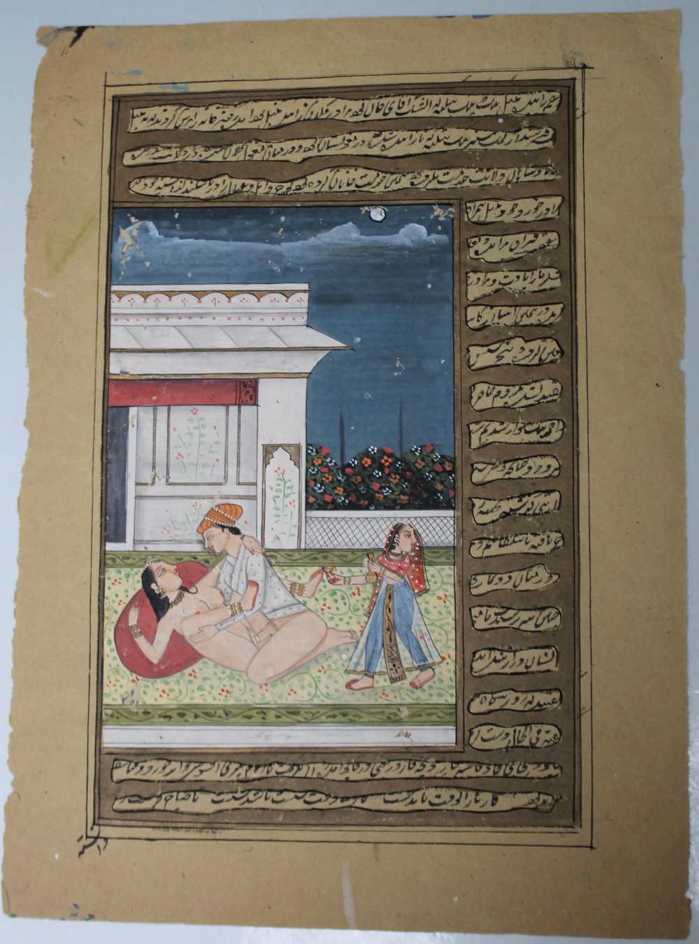 INDIAN MOGHUL SCHOOL (1800-1900). Erotic scene in lakeside palace, inscribed, unsigned, gouache on