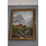 A GILT FRAMED OIL ON CANVAS DEPICTING HIGHLAND CATTLE IN A MOUNTAINOUS LANDSCAPE SIGNED E HEATON