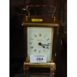 A VINTAGE BAYARD 8 DAY BRASS AND GLASS CARRIAGE CLOCK