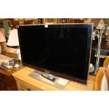 A LARGE SAMSUNG 40" FLATSCREEN TV - REMOTE