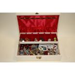 A BOX OF COSTUME JEWELLERY