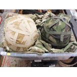 A TRAY OF CAMOUFLAGE ITEMS ETC TO INCLUDE HELMETS