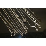 A BAG OF SILVER NECKLACES AND BRACELETS ETC