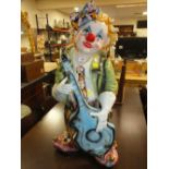 A LARGE PORCELAIN CLOWN FIGURE - H 84 CM