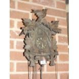 A VINTAGE CARVED BLACK FOREST STYLE CUCKOO CLOCK