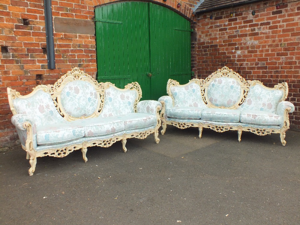 A LARGE PAIR OF ITALIAN CREAM PAINTED ROCOCO TYPE SOFAS WITH LIGHT BLUE SILK UPHOLSTERY - W 230