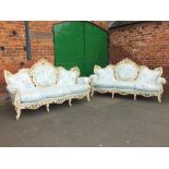 A LARGE PAIR OF ITALIAN CREAM PAINTED ROCOCO TYPE SOFAS WITH LIGHT BLUE SILK UPHOLSTERY - W 230